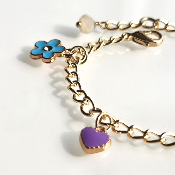 Charm bracelet. 6 inches with 1 inch extender. Gold w/ colorful charms. - Picture 3 of 5